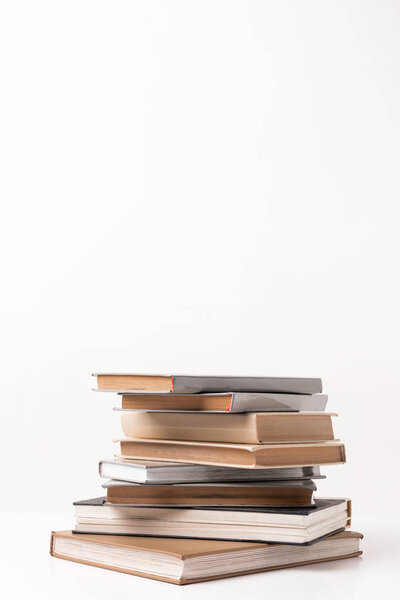 Stack of different books isolated on white 