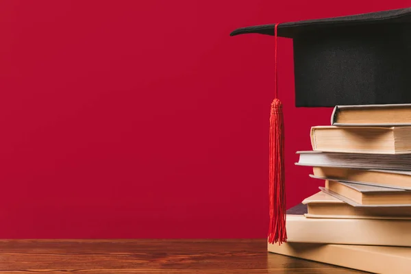 Cropped View Stack Books Academic Cap Red — Stock Photo, Image