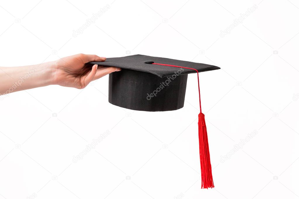 Cropped view of female holding academic cup isolated on white