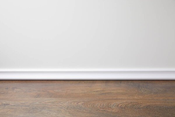 белая стена и деревянный пол в квартире
