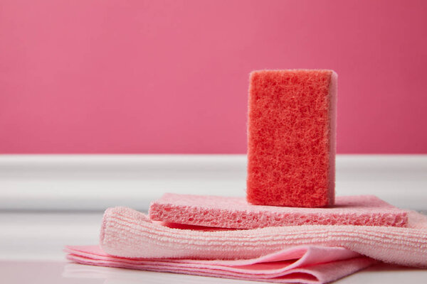 pink washing sponge and rags for spring cleaning