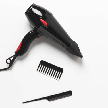 top view of hair dryer and two combs, on white clipart