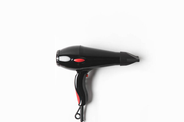 top view of black hair dryer, on white