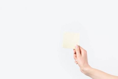 cropped shot of woman holding blank sticky note in hand isolated n white clipart