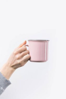cropped shot of woman holding pink mug in hand isolated on white clipart