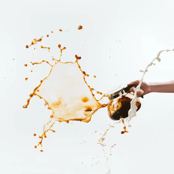 Cropped View Hand Holding Glass Pot Splashes Milk Coffee Isolated — Stock Photo, Image