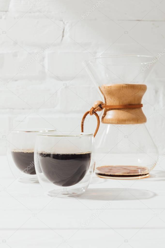 Closeup shot of alternative coffee in glass cups and chemex