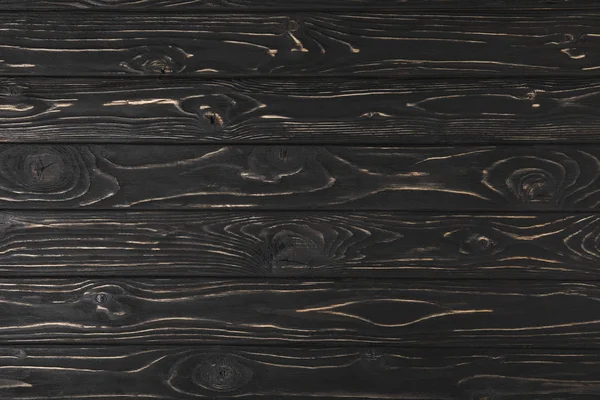 full frame image of dark rough wooden surface