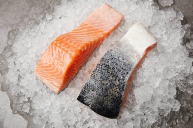 close-up shot of sliced salmon fillet on crushed ice clipart