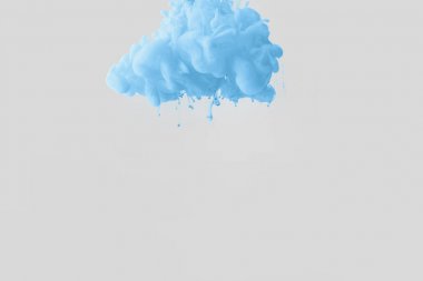 close up view of bright pale blue paint splash in water isolated on gray clipart
