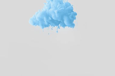 close up view of bright pale blue paint splash in water isolated on gray clipart