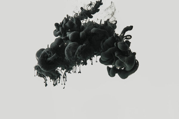 Close up view of black ink in water isolated on gray