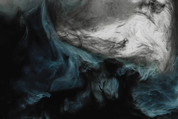 full frame image of mixing of light gray, turquoise and black paints splashes in water isolated on gray