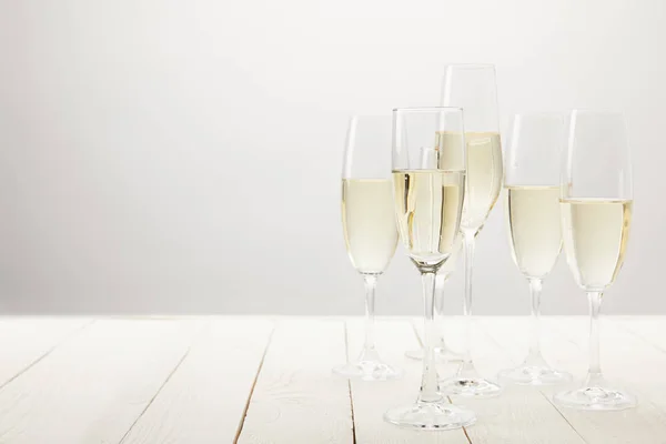 Closeup Shot Champagne Glasses White Wooden Table — Stock Photo, Image