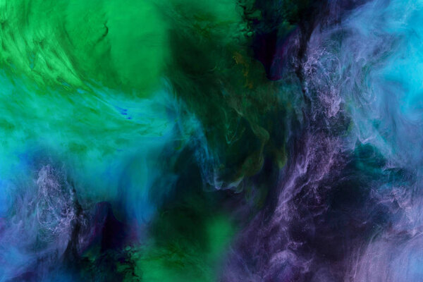 artistic texture with blue, purple and green paint swirls looks like space