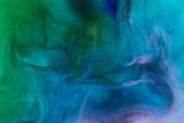 creative background with blue and green swirling paint