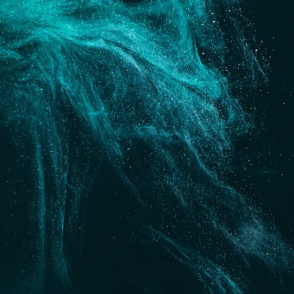 magic artistic texture with turquoise paint on black 