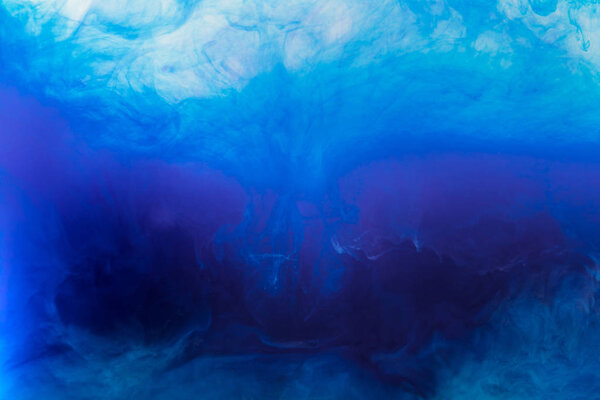 abstract texture with blue watercolor paint flowing in water