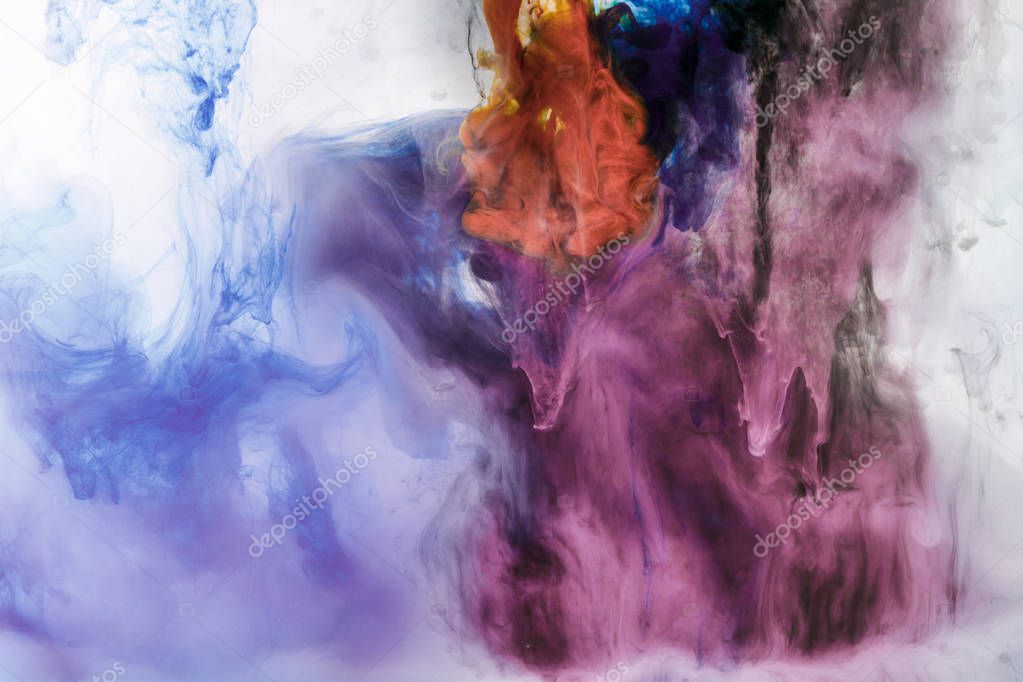 creative background with blue and violet flowing paint in water