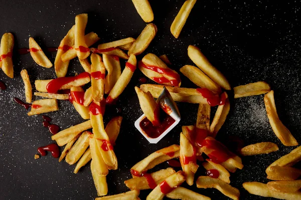Top View French Fries Poured Ketchup Spilled Salt Black — Free Stock Photo