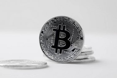 close-up shot of bitcoin standing on white surface clipart