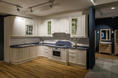 Renovated kitchen interior in white and blue tones clipart