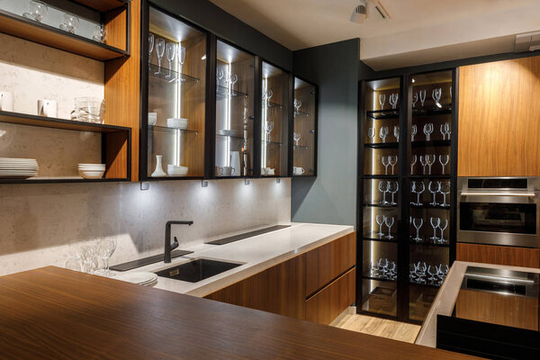 Renovated kitchen interior with glass cabinets
