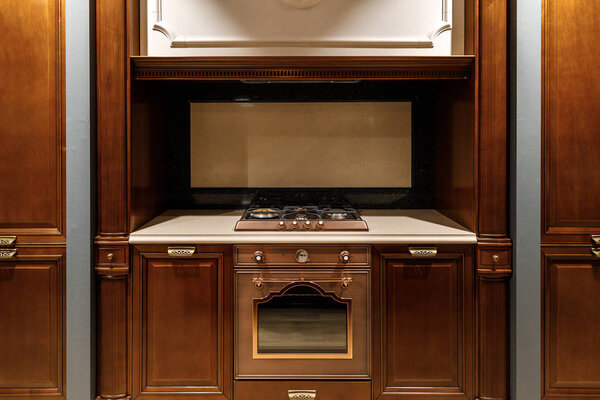 Interior of modern kitchen with stove and oven