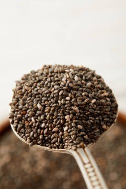selective focus of chia seeds in spoon clipart
