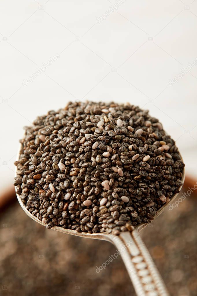 selective focus of chia seeds in spoon