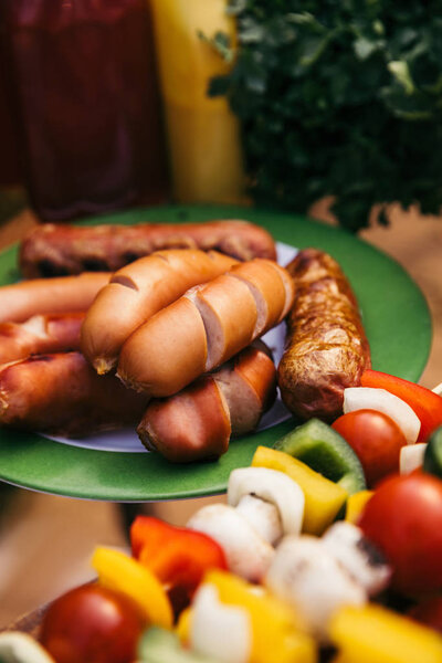 Close-up view of meat sausages grilled for outdoors barbecue