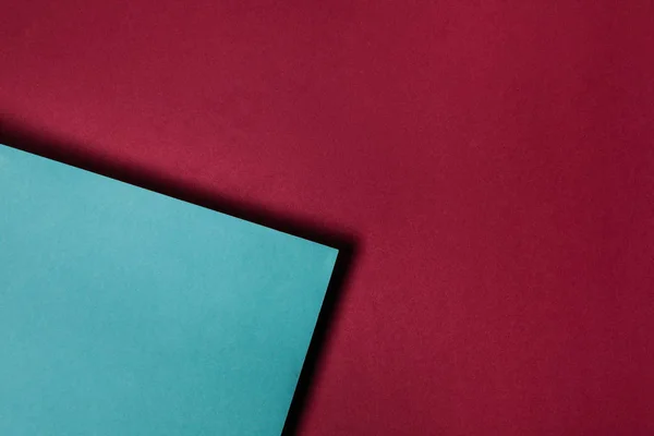 Turquoise Paper Sheet Maroon Background — Stock Photo, Image