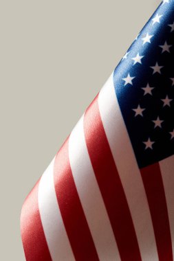 close up view of united states of america flag, isolated on grey clipart