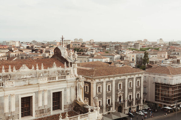 CATANIA, ITALY - OCTOBER 3, 2019: church near small old houses in catania, italy 