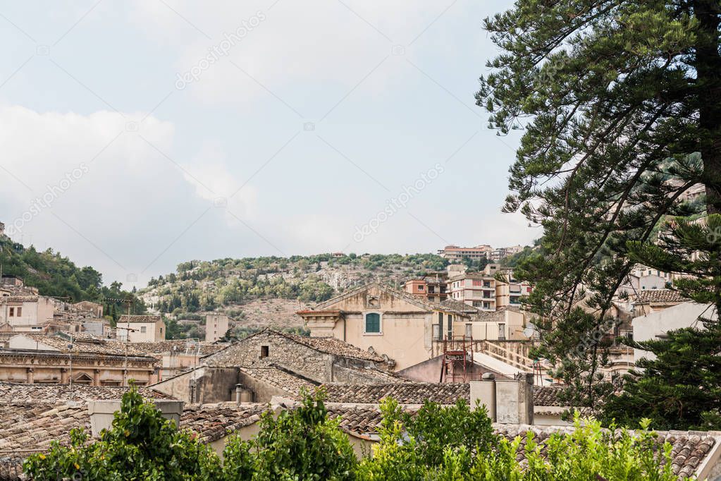 small houses near green plants and trees in modica, italy 