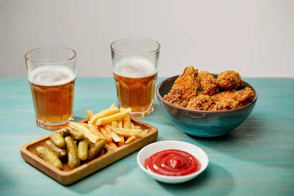 Delicious Chicken Nuggets Ketchup French Fries Gherkins Glasses Beer Turquoise — Stock Photo, Image