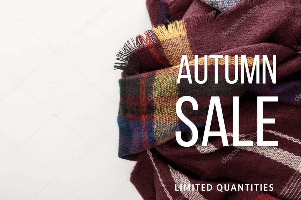 top view of burgundy wool plaid scarf on white background with autumn sale illustration 