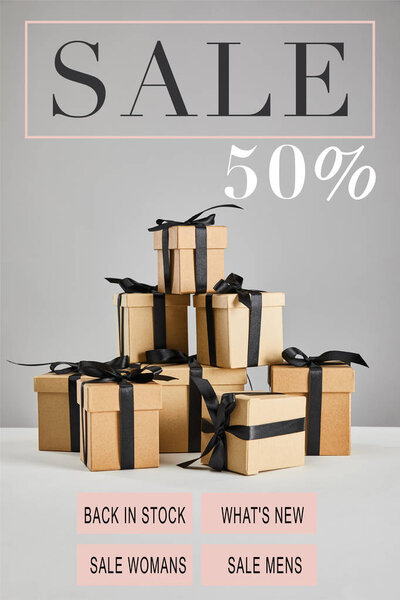 cardboard gift boxes with black ribbons isolated on grey with sale 50 percent illustration, black Friday concept