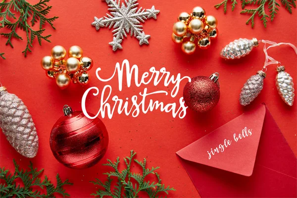 Top View Shiny Christmas Decoration Envelope Thuja Red Background Merry — Stockfoto