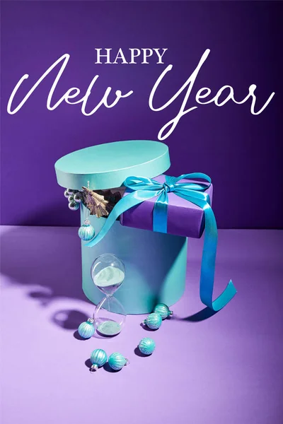 Blue Box Christmas Decoration Present Hourglass Purple Background Happy New — Stock Photo, Image