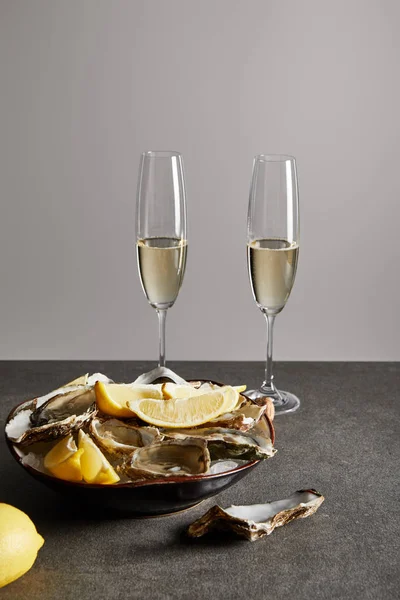 Champagne Glasses Sparkling Wine Delicious Oysters Lemons Bowl Isolated Grey — Stock Photo, Image