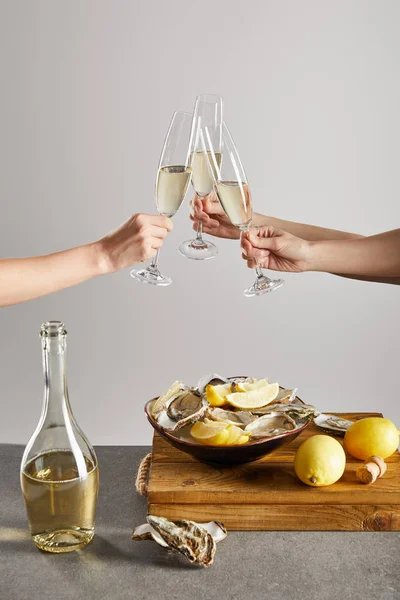 Cropped View Women Clinking Champagne Glasses Sparkling Wine Bowl Oysters — Stock Photo, Image