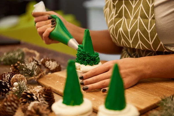 Selective Focus Confectioner Decorating Tasty Christmas Tree Cupcakes Spruce Cones — Stock Photo, Image