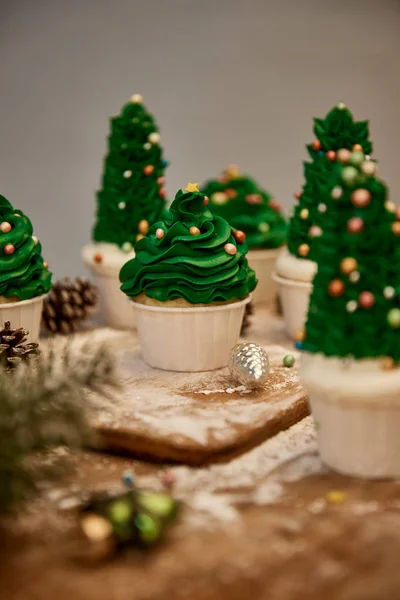Selective Focus Decorated Christmas Tree Cupcakes Sweet Cream Spruce Cones — Stock Photo, Image