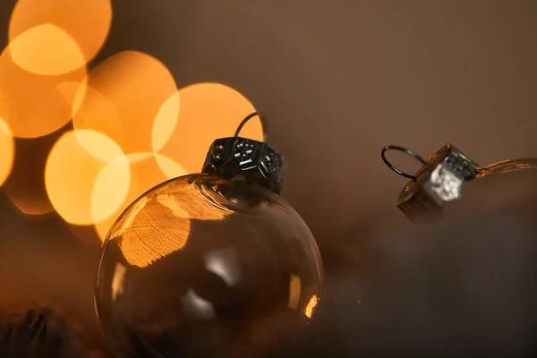 Close Transparent Christmas Balls Blurred Yellow Lights — Stock Photo, Image