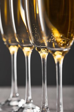 close up of sparkling wine in glasses on grey clipart