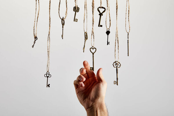 top view of vintage rusty keys on white background
