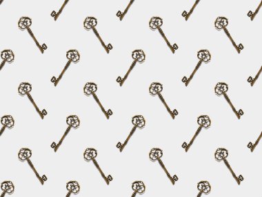 seamless pattern with vintage keys on white background clipart