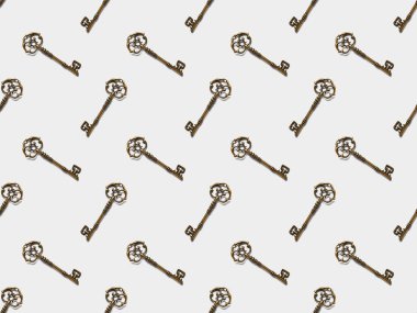 seamless pattern with vintage keys on white background clipart