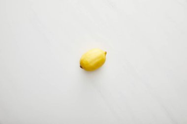 Top view of fresh lemon on marble background clipart